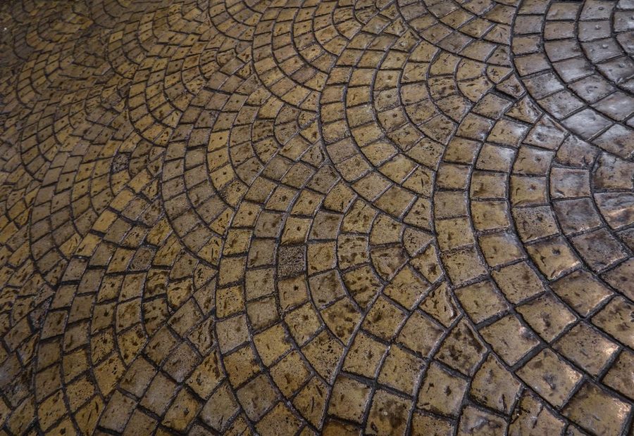 Stamped and colored concrete patio with a stone-pattern finish and sealer